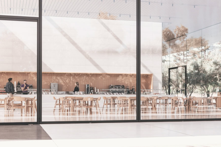 Modern, minimalist café interior with floor-to-ceiling glass windows, light wooden furniture, and a sleek coffee counter — a space designed with architectural precision and natural light.